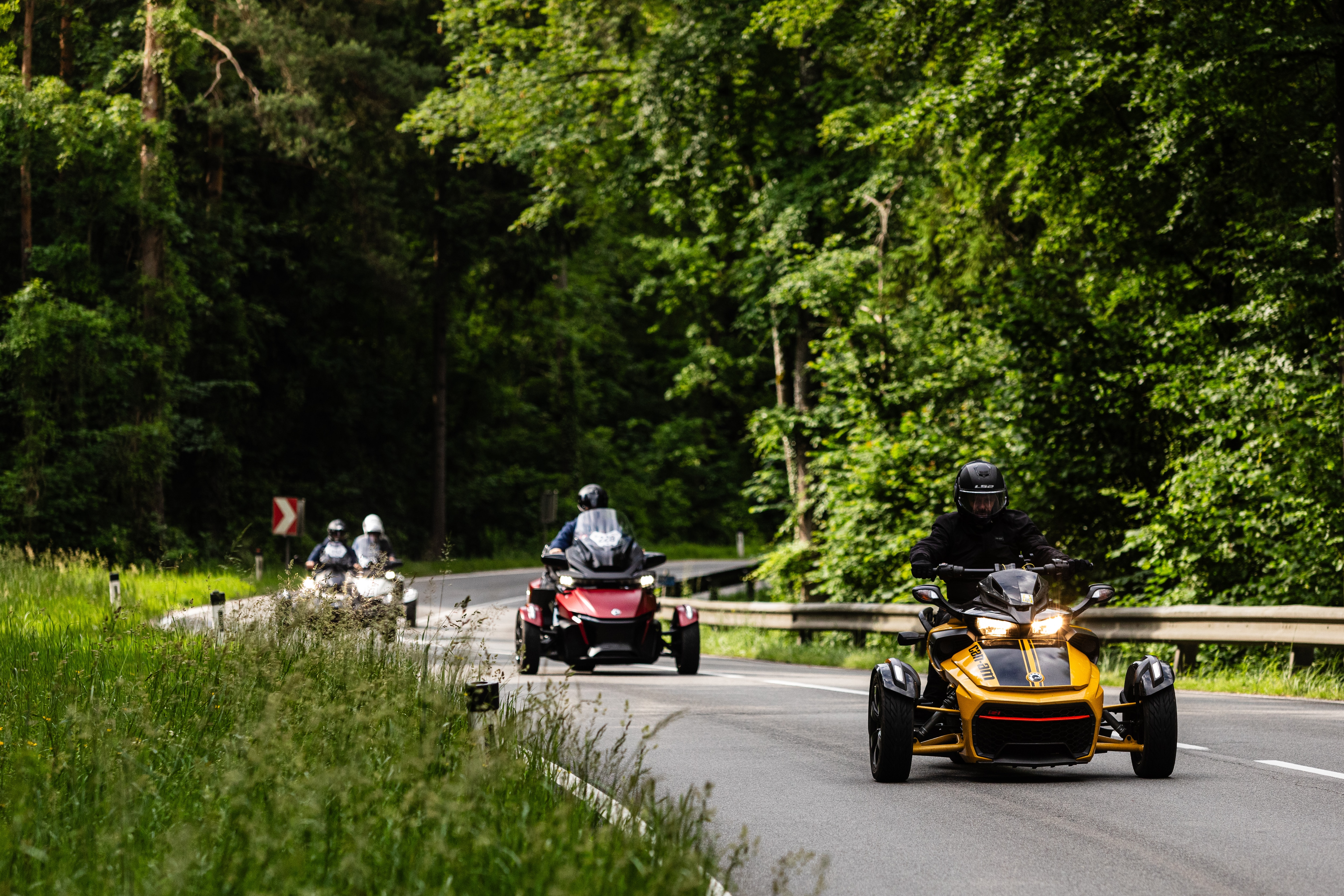 Can-Am Spyders on the road in the forest